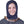 Person wearing a navy blue adjustable head wrap for migraine relief
