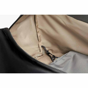 Interior view of a Bellroy bag showing the beige lining and a small black key clip