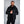 Man wearing a black 8K FlexWarm hooded puffer jacket