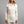 Merino Skins cream long sleeve zip neck top on a model