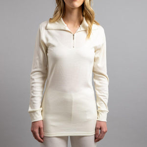 Merino Skins cream long sleeve zip neck top on a model
