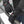 Person wearing black ActionHeat battery heated gloves with adjustable wrist straps