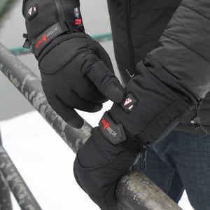 Person wearing black ActionHeat battery heated gloves with adjustable wrist straps
