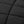 Close up of black quilted fabric texture