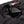 Radians black battery pack connected to a garment pocket