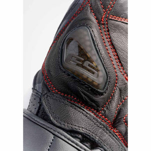 REV IT motorcycle glove knuckle protector with red stitching on black leather