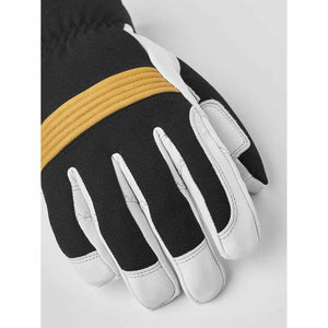 Hestra black and white ski glove with yellow knuckle detailing