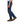 Side view of Black Diamond blue technical climbing pants with grey reinforced panels
