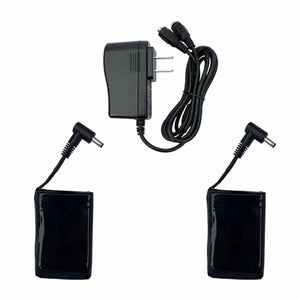 Black power adapter with two attached battery packs and cables