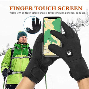 Person wearing black touchscreen compatible gloves using a smartphone in a snowy outdoor setting