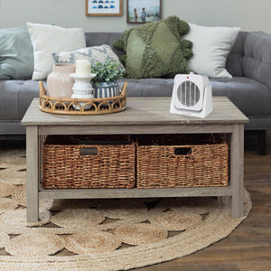 World Marketing white portable space heater on a wooden coffee table in a living room