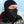 Person wearing a black Seirus balaclava with a perforated face mask