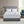 Serta heated mattress pad on a bed with two white pillows and two controllers