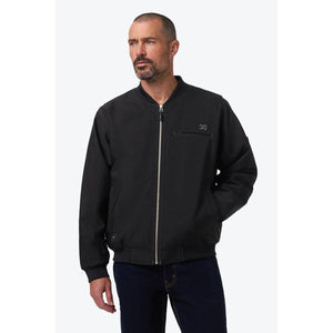 Man wearing a black Mobile Warming bomber jacket with a front zipper and chest pocket