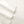 Close up of folded white cotton bed sheet with stitched hem detail