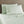Shavel sage green bed sheet set with two pillows on a bed