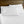 White bed sheets and pillowcases against a wooden headboard