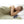Person sleeping under a quilted electric blanket with a digital controller