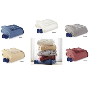 Five folded electric blankets in indigo vanilla smoke camel and merlot colors with remote controls