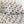 Bed sheets and pillowcases with a winter village pattern featuring red houses, pine trees, and deer