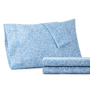 Blue pillowcase and folded sheet set with white damask floral pattern