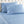 Shavel blue and white floral scroll pattern sheet set on a tufted headboard bed