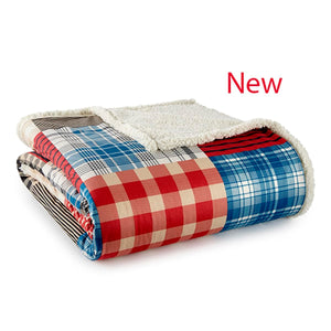 Folded patchwork plaid throw blanket with white sherpa lining