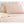 Shavel beige bed sheet set with two pillows against a tufted headboard