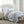Shavel grey and blue plaid heated blanket on a bed