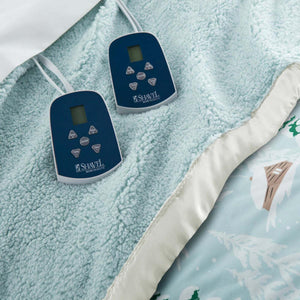 Two Shavel electric blanket controllers on a light blue textured blanket