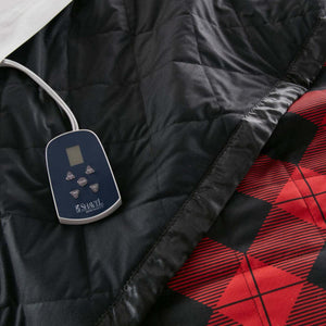 Shavel heated blanket controller on black and red plaid quilted fabric