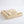 Folded beige fleece blanket with satin trim