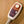 Shield Life handheld temperature controller with dial and power button on a textured tan surface