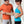 Man helping woman fasten a Shield Life back support belt