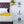 Shield Life heating pad on a bed with icons for fire protection, temperature settings, and negative ion therapy