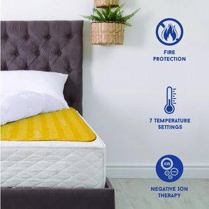 Shield Life heating pad on a bed with icons for fire protection, temperature settings, and negative ion therapy