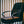 Shield Life heating pad placed on a black office chair in front of vertical blinds