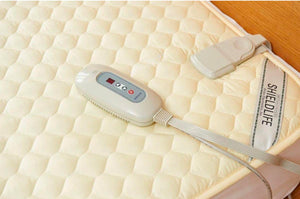Shield Life heating pad with cream quilted fabric and digital controller