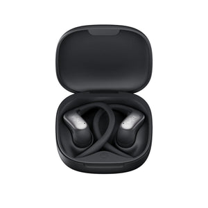 Shokz open ear wireless earbuds in an open black charging case