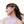Woman wearing Shokz bone conduction headphones