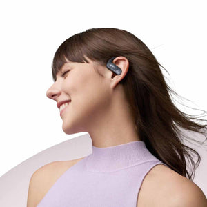 Woman wearing Shokz bone conduction headphones