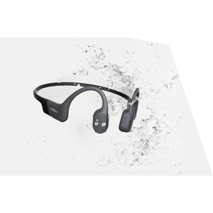 Shokz bone conduction headphones surrounded by water splashes