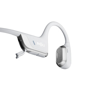 White Shokz bone conduction headphones with open charging port
