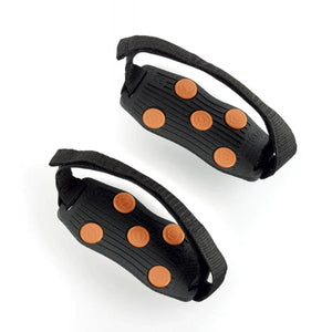 Sidas black rubber traction cleats with orange studs and adjustable straps