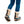 Sidas traction cleats attached to Sorel winter boots worn with blue jeans