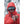 Person in red hooded jacket holding Smith Optics sunglasses