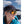 Person wearing Smith sunglasses and a black cap against a mountain background