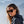 Woman wearing Smith Optics sunglasses with dark frames and tinted lenses