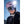 Person wearing a Smith Optics pink helmet and mirrored goggles against a bright blue sky