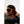 Person wearing Smith Optics yellow frame sunglasses and a black cap